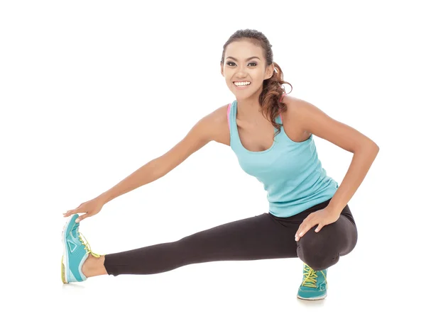Woman doing legs stretching — Stock Photo, Image