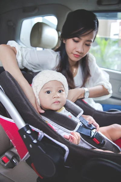 Mother securing baby — Stock Photo, Image