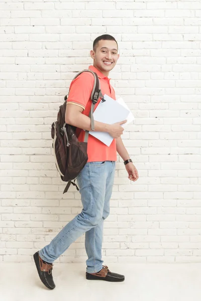 College student carrying some books — Stock Photo, Image