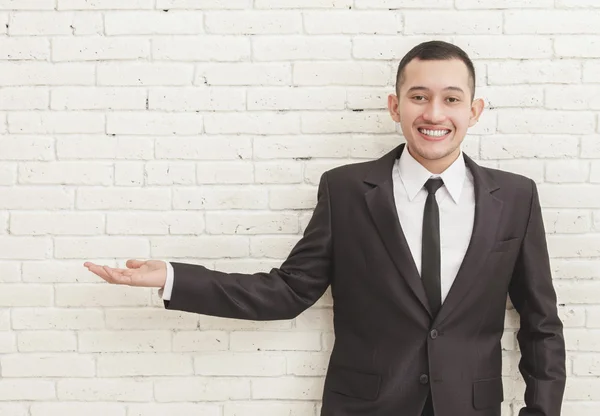 Businessman presenting copy space — Stock Photo, Image