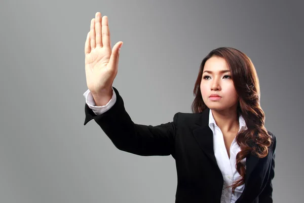 Immagine donna d'affari di mano spingendo qualcosa — Foto Stock