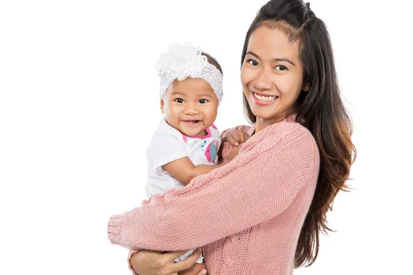 Mujer sosteniendo bebé niña —  Fotos de Stock