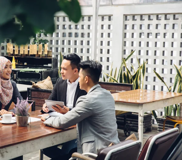 Creative business meeting in a cafe — Stock Photo, Image