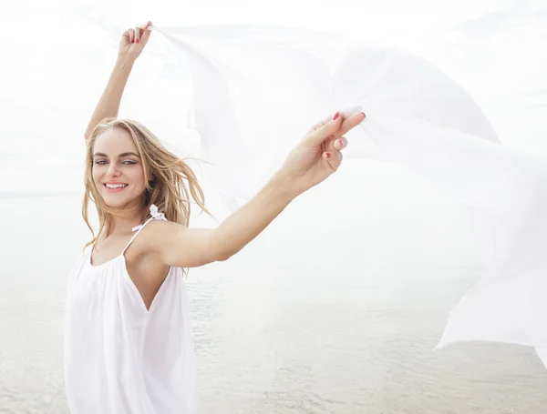 Pretty woman with white scarf — Stock Photo, Image