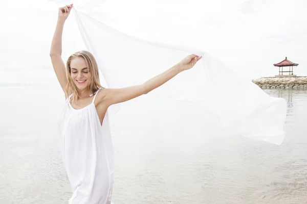 Pretty woman with white scarf — Stock Photo, Image