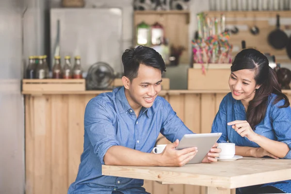 Young business partners using tablet — Stock Photo, Image