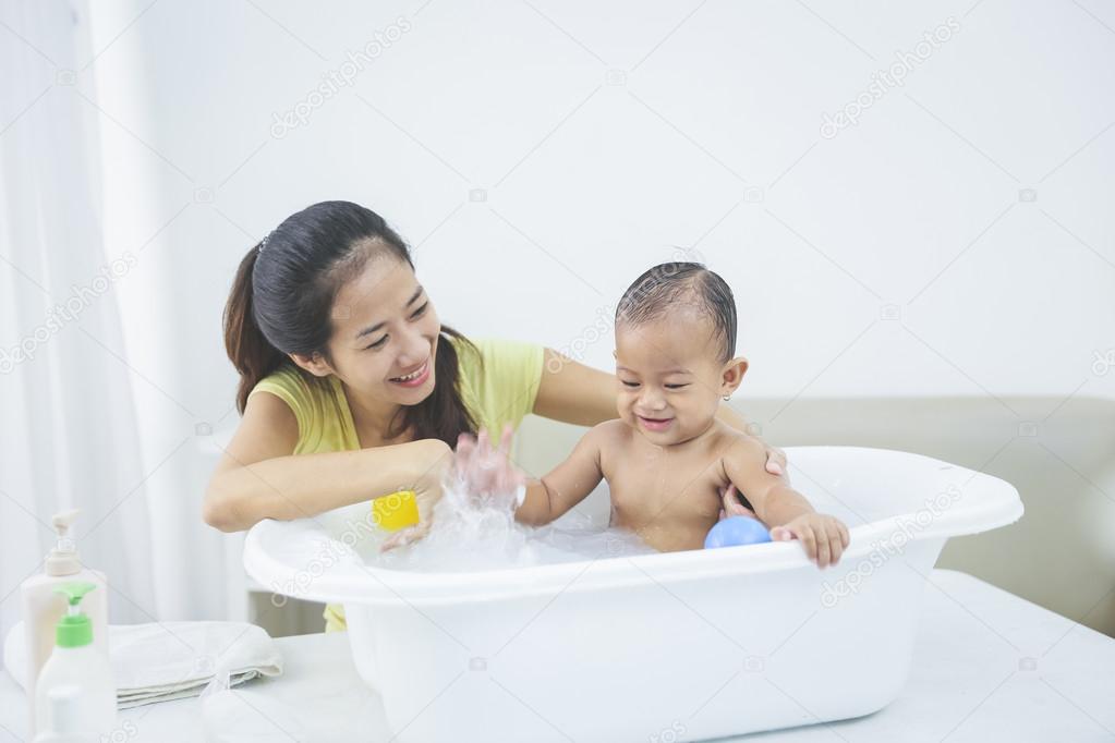 Baby having bath deals