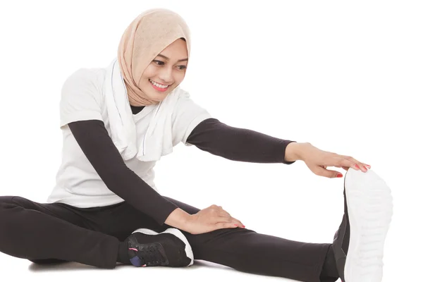 Woman doing leg stretching — Stock Photo, Image