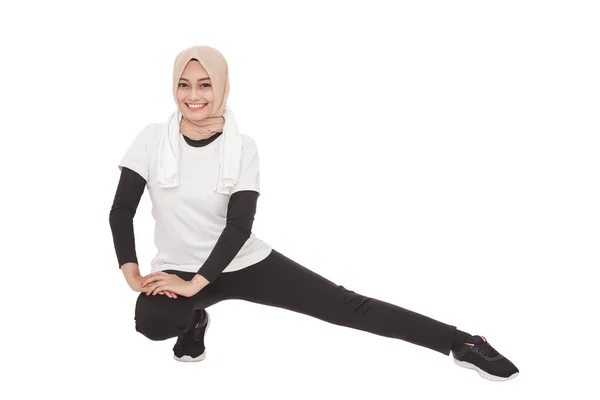Woman doing leg stretching — Stock Photo, Image