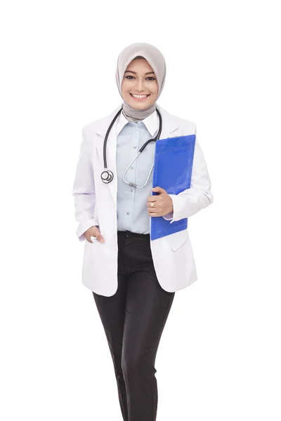 Beautiful asian female doctor with stethoscope and pad Royalty Free Stock Images