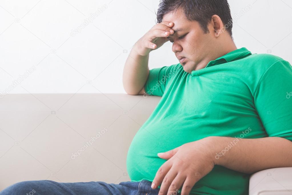 obese man thinking about his weight problem