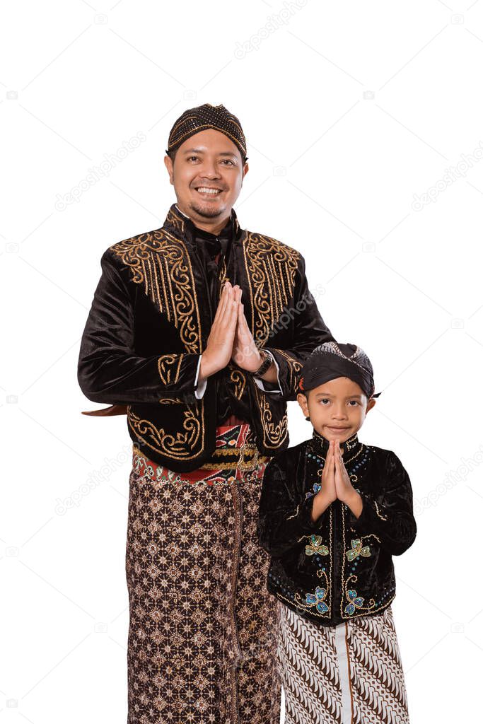 A portrait greetings of a father and son in Javanese traditional costume.