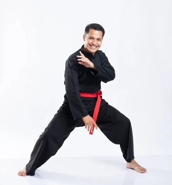 Asian men wear pencak silat sports uniforms to fight — Stock Photo, Image