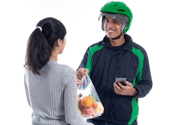 Asian delivery courier delivering food to female customer — Stock Photo, Image