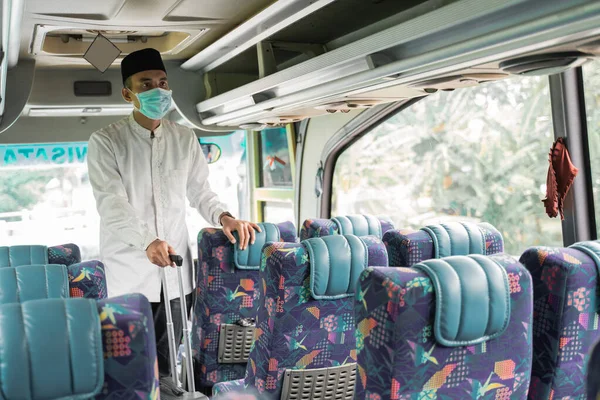 male muslim travel by bus during pandemic