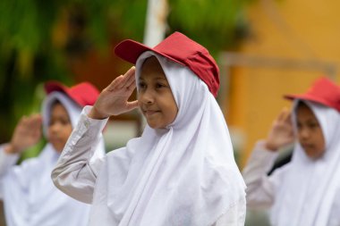 Indonesian Flag honor is performed by all flag ceremony participants