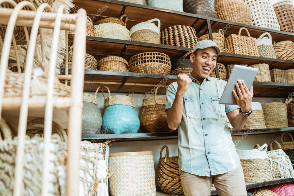 happiness business owner use tablet when in a craft shop