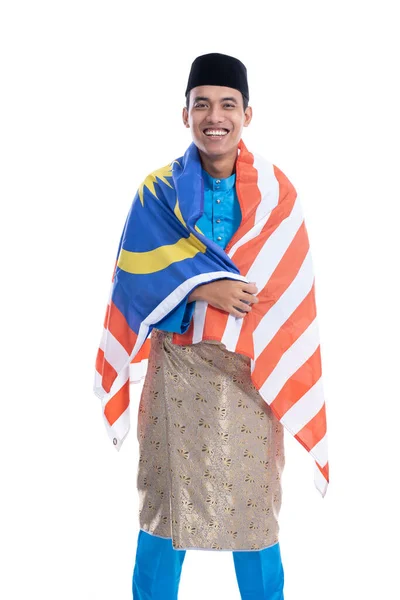 Excited malaysian male muslim with flag — Stock Photo, Image