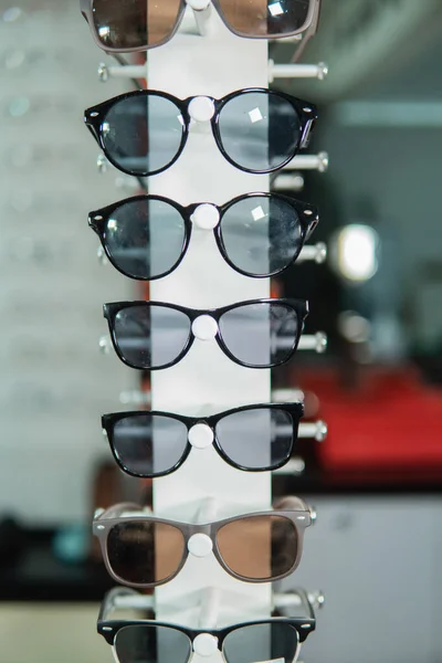 A set of glasses on a special eyeglass shelf — Stock Photo, Image