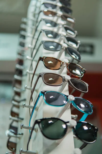 A set of glasses on a special eyeglass shelf — Stock Photo, Image