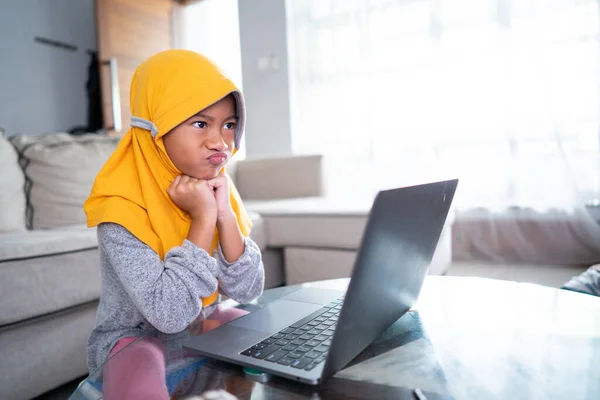Unhappy muslim young kid while studying from home — Stock Photo, Image