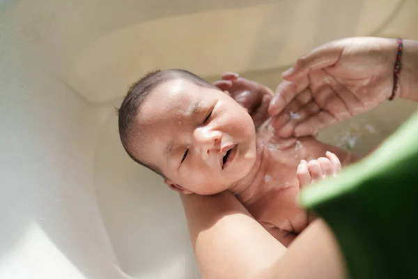 New born infant taking a bath in the morning — Stock Photo, Image