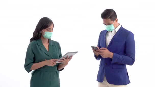 Portrait of a busy business partner. tablet or phone with masks and social distancing — Wideo stockowe