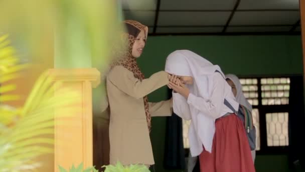 Portrait of islamic school students kissing the teachers hand — Stock Video