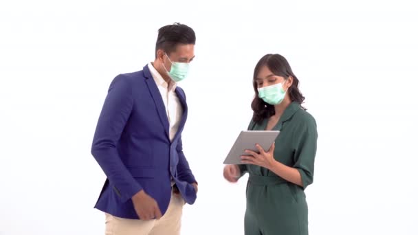Happy business partner portrait explaining project on tablet together with masks — Wideo stockowe