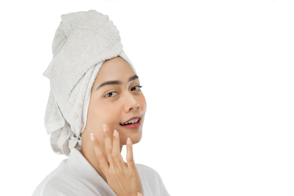 Beautiful girl with bath towel on head with finger pose gently holding cheek with copy space — Stok fotoğraf