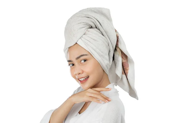 Attractive girl with bath towel on head smiling at camera — Fotografia de Stock