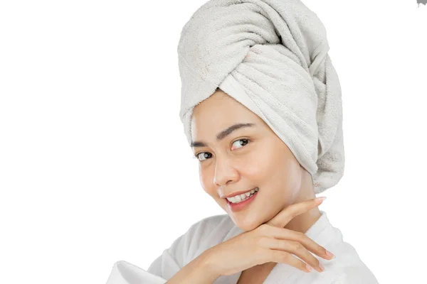 Asian girl with bath towel on head smiling with hands under chin — Stok fotoğraf