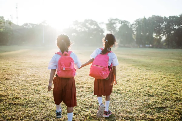Two girl friend primary school student walking together — Stock Photo, Image