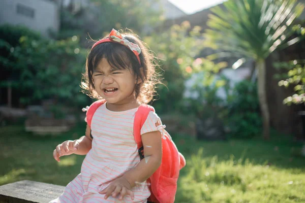 Unhappy beautiful asian preschoolers toddler student in the park — Stock Photo, Image