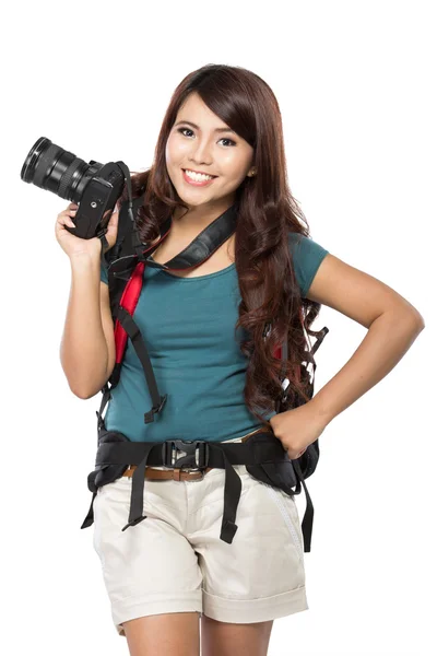 Female backpacker going on vacation with backpack and camera — Stock Photo, Image