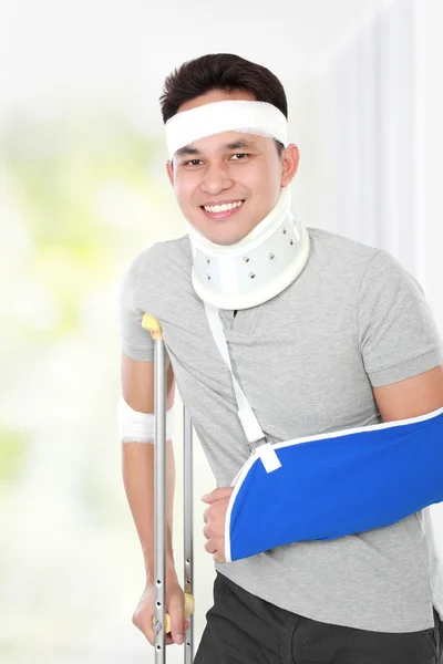Injured young man but still feel happy — Stock Photo, Image