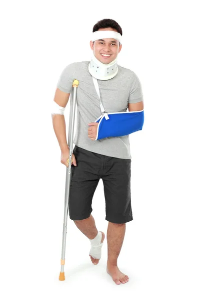 Injured young man on crutch — Stock Photo, Image