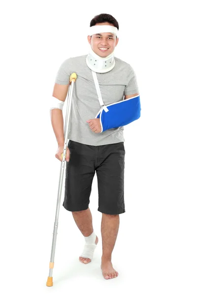 Injured young man on crutch — Stock Photo, Image