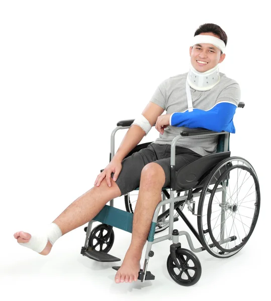 Injured young man in wheelchair — Stock Photo, Image