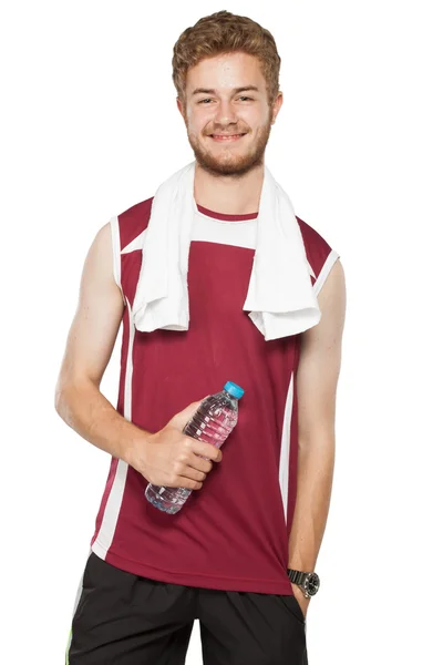 Healthy man with bottle of water — Stock Photo, Image