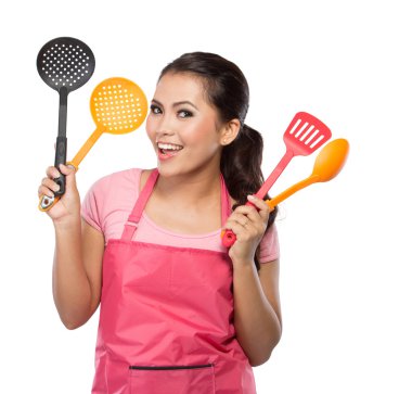 bir spatula tutan mutlu kadın
