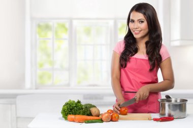 Young Woman Cooking in the kitchen clipart