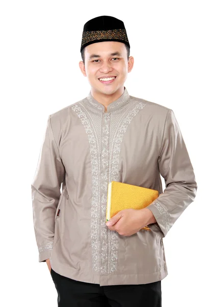 Young muslim man carrying the Quran — Stock Photo, Image