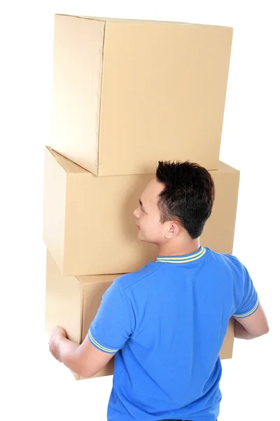 Young man carrying stack of cardboxes — Stock Photo, Image