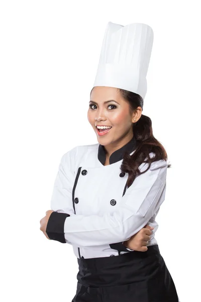 Female chef in a traditional hat and coat — Stock Photo, Image