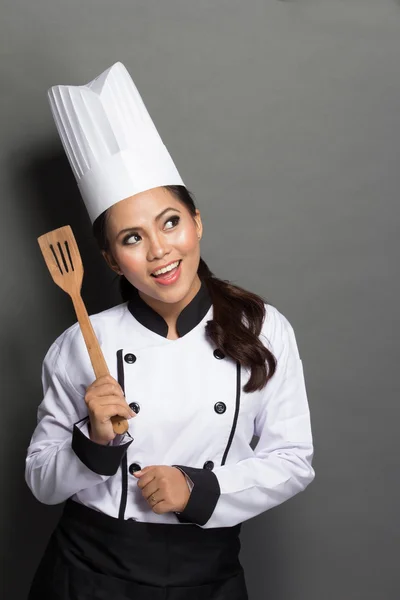 Jonge vrouw chef-kok denken — Stockfoto