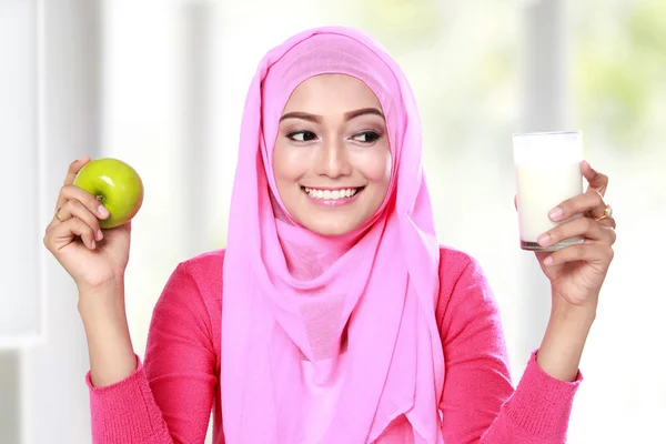 Between an apple and  a glass of milk — Stock Photo, Image