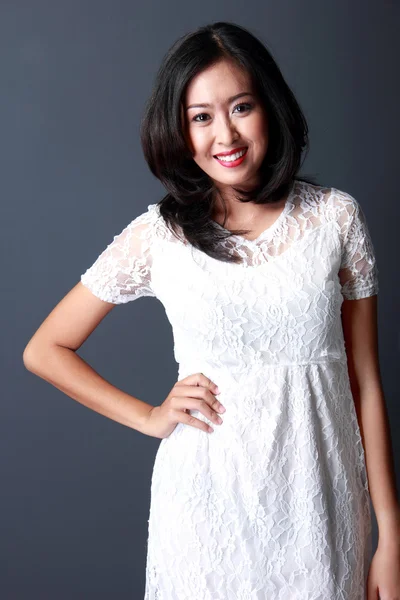 Young woman wearing white dress — Stock Photo, Image