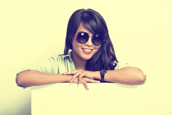 Young woman happy posing with white blank billboard — Stock Photo, Image