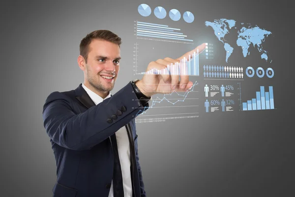 Young businessman pushing at virtual screen — Stock Photo, Image